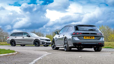 Peugeot 508 SW Sport Engineered vs BMW 330e xDrive Touring - both cars static rear