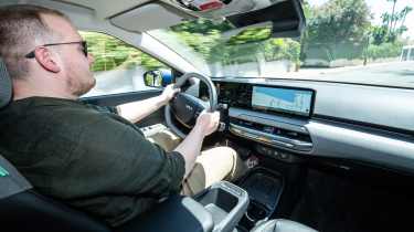 Ellis Hyde driving the Kia EV4