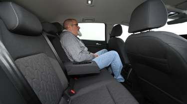 Auto Express senior test editor Dean Gibson sitting in the Volkswagen Golf's rear seat