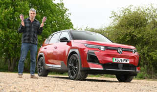 Auto Express deputy editor Richard Ingram standing next to the Citroen e-C5 Aircross