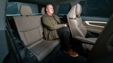 Ellis Hyde sat in the rear of the Audi Q9