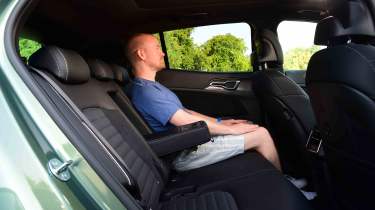 Kia Sportage - rear seats with Chief reviewer, Alex Ingram