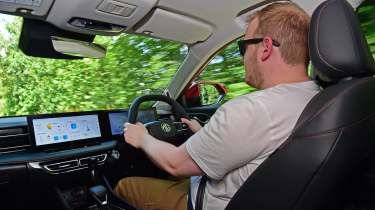 New MG HS - front interior driving shot with Auto Express news reporter Ellis Hyde 