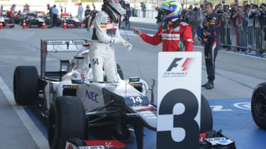 Kamui Kobayashi celebrates his third place finish in the Japanese Grand Prix