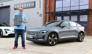 John McIlroy standing next to the Polestar 2 outside the Andersen factory 