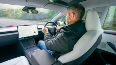 Auto Express deputy editor Richard Ingram driving the Tesla Model 3