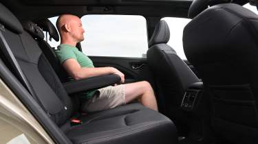 Auto Express chief reviewer Alex Ingram sitting in the Subaru Forester&#039;s back seat