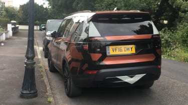 Land Rover Discovery 2017 - spy shot orange rear quarter