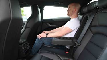 Porsche Taycan - rear seats with Chief reviewer, Alex Ingram