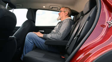 Nissan Qashqai - rear seats being sat in by Auto Express senior reviewer Dean Gibson