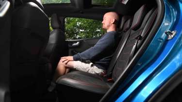 Ford Puma - rear seats with Chief reviewer, Alex Ingram