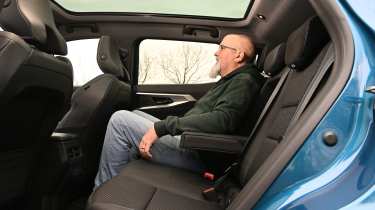 Renault Austral - rear seats being sat in by Auto Express senior test editor Dean Gibson