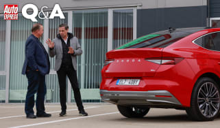 Auto Express editor-in-chief Steve Fowler talking with Skoda CEO Klaus Zellmer while standing next to a Skoda Enyaq Coupe