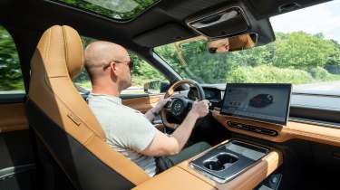 Auto Express chief reviewer Alex Ingram driving the Mazda 6e
