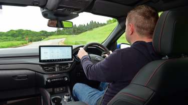 Auto Express senior content editor Shane Wilkinson driving the Ford Kuga