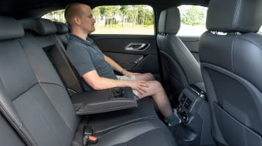 Auto Express chief reviewer Alex Ingram sitting in the back of the Range Rover Velar
