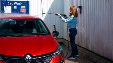 Auto Express pictures editor Dawn Grant washing the Renault Clio