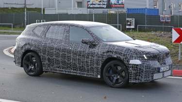 BMW iX3 M - front angled on a round-about