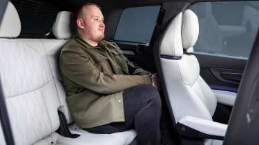 Ellis Hyde sat in the back seats of the Audi Q9