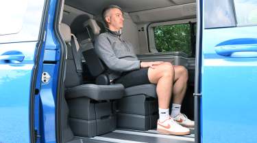 Auto Express deputy editor Richard Ingram sitting in the Volkswagen California eHybrid's rear seat