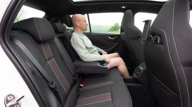 Auto Express chief reviewer Alex Ingram sitting in the Skoda Kamiq&#039;s back seat