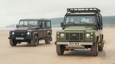 Land Rover Defender V8 110 by Works Bespoke - two cars front tracking