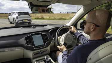 Volvo XC90 - front interior with the car being driven by Auto Express chief reviewer Alex Ingram 