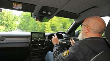 Dacia Duster Hybrid - interior, car being driven by Auto Express senior test editor Dean Gibson