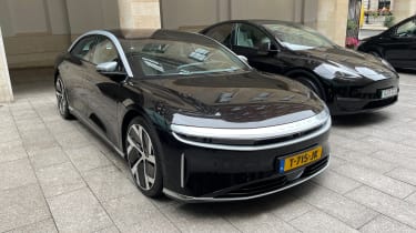 Lucid Air parked next to Tesla Model 3