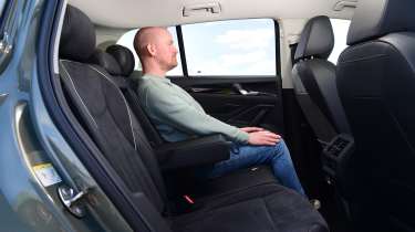 Auto Express chief reviewer Alex Ingram sitting in the Volkswagen Tiguan&#039;s back seat