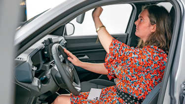 Dacia owner taking a inspecting the Dacia Duster&#039;s interior