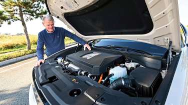 Tomas Hirschberger looking at the Hyundai Nexo's engine bay