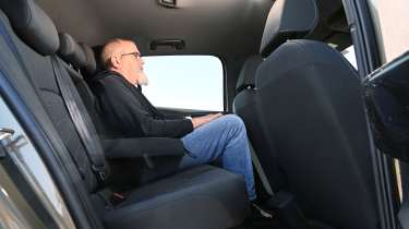 Volkswagen ID.3 - rear seats being sat in by Auto Express senior test editor, Dean Gibson