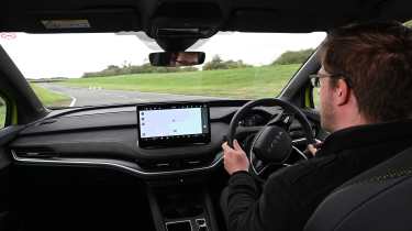 New Skoda Elroq vRS UK - interior, car being driven by Auto Express online reviews editor Max Adams