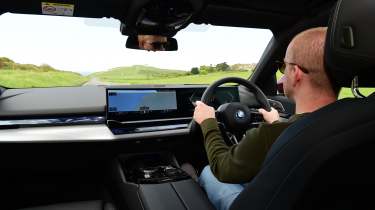 Auto Express chief reviewer Alex Ingram driving the BMW 530e M Sport Pro 