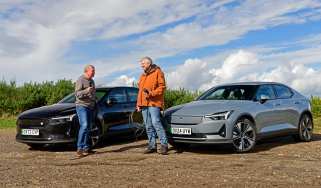 Auto Express consumer editor Chris Rosamond and contributor Steve Sutcliffe standing in front of two Polestar 2s