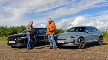 Auto Express consumer editor Chris Rosamond and contributor Steve Sutcliffe standing in front of two Polestar 2s