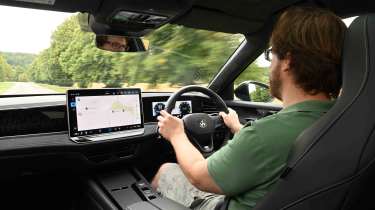 Volkswagen Passat - interior driving shot with online reviews editor, Max Adams