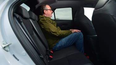 John McIlroy sitting in the back of the Toyota C-HR