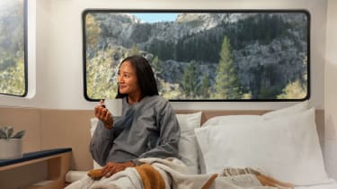 Person in bed in the Pebble Flow caravan