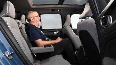 Volvo EX40 - rear seats being sat in by Auto Express senior test editor Dean Gibson