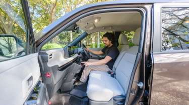 Nissan Sakura - front interior, with Auto Express senior staff writer Jordan Katsianis sitting in the drivers seats