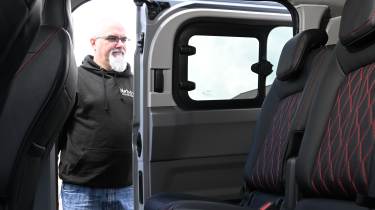 Auto Express senior test editor Dean Gibson opening the Volkswagen Transporter Sportline's sliding door