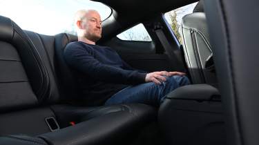 Auto Express chief reviewer Alex Ingram sitting in the Ford Mustang&#039;s rear seat