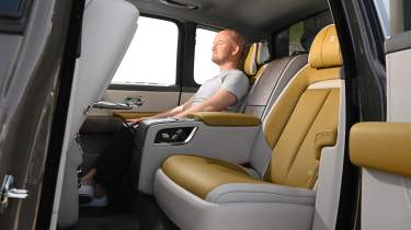 Auto Express chief reviewer Alex Ingram sitting in the Rolls-Royce Cullinan Series II&#039;s back seat