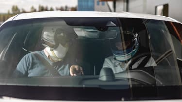 Porsche Taycan Turbo S - John McIlroy and Marc Lieb sitting in car (viewed through windscreen)