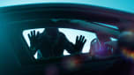Car thief looking through a window