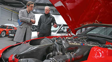 Auto Express consumer reporter Tom Jervis inspecting a BMW M1&#039;s engine bay