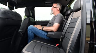 Auto Express senior test editor Dean Gibson sitting in the back of the Volkswagen Amarok