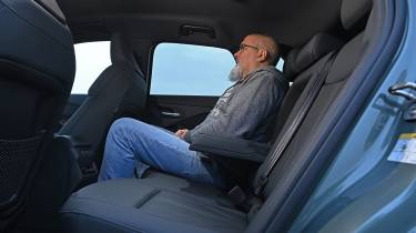 Auto Express senior road test editor Dean Gibson sitting in the Audi Q3's rear seat